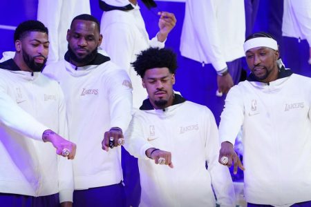 Los Angeles Lakers players Anthony Davis, LeBron James, Quinn Cook and Kentavious Caldwell-Pope display their rings on opening night. (Mandatory credit: Kirby Lee-USA TODAY Sports/Reuters)