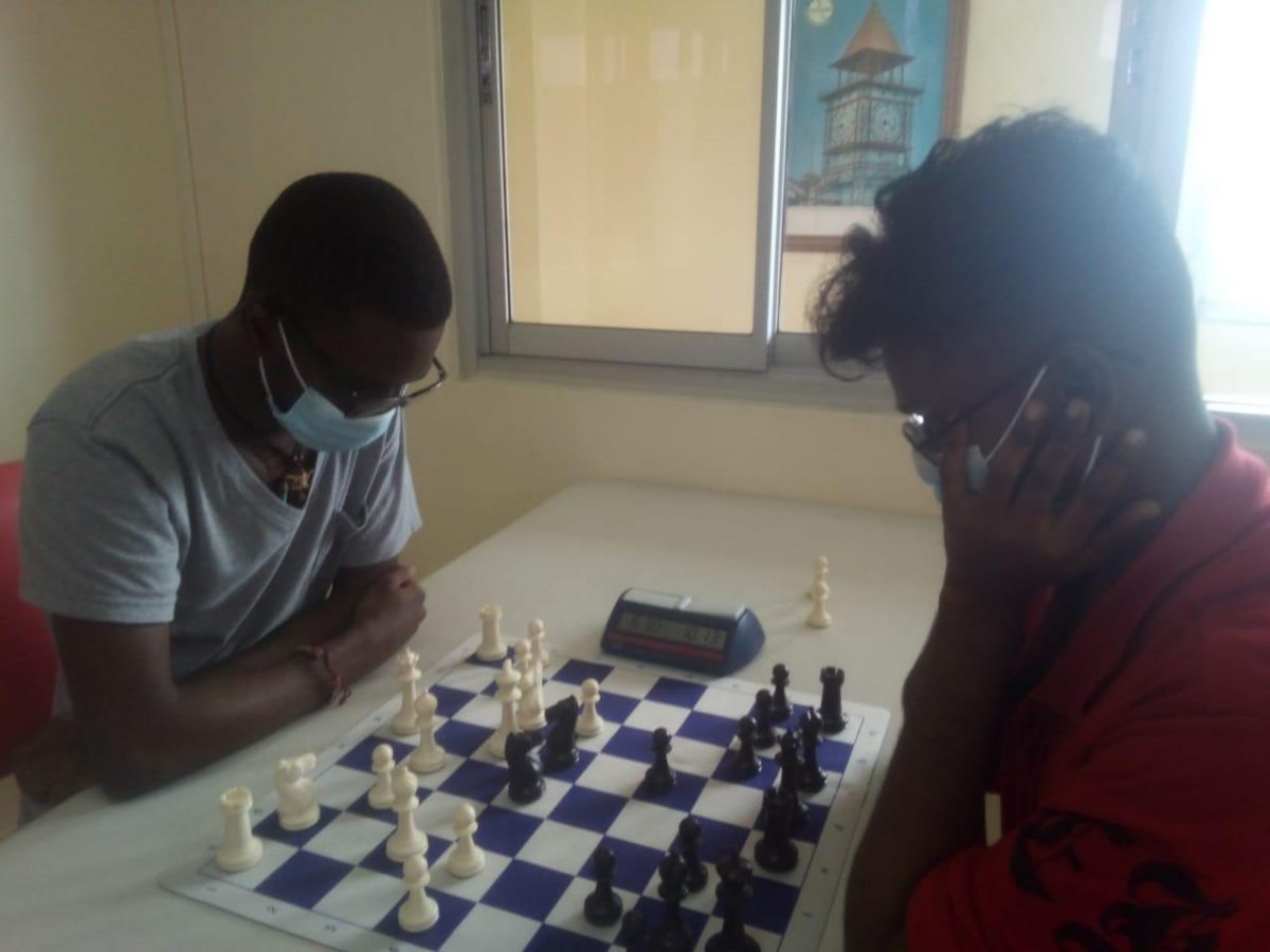 National Rapid Champion, Davion Mars (left) during his upset loss to newly crowned Junior Rapid Chess Champion, Joshua Gopaul.
