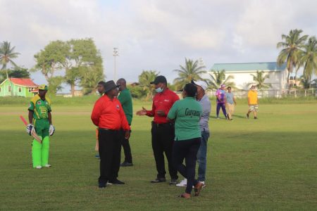 Match officials looked in a heated discussion as Jai Hind Jaguars contest the conditions of the ground.