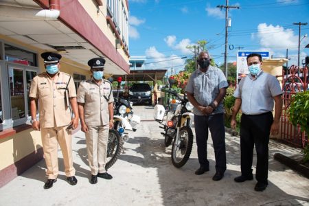 From left are Traffic Chief, Ramesh Ashram, Deputy Commissioner of Operations, Clifton Hicken, Minister  Robeson Benn and Sean Ramrattan, owner of RRT Enterprise. (DPI photo)