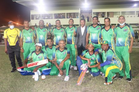 Secretary of the Guyana Cricket Board, Anand Sanasie (in suit) is flanked by members of the West Demerara Masters side (Romario Samaroo photo)
