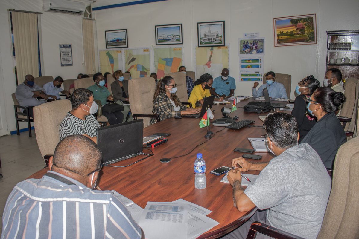 GWI CEO Shaik Baksh (seated at head of table) engages GWI’s managers from across the country at the meeting yesterday 