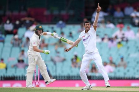 Debutant Navdeep Saini of India successfully appeals for his first test wicket, taking Will Pucovski of Australia LBW for 62 during day one of the third test match between Australia and India at the SCG, Sydney, Australia, January 7, 2021. Photo: AAP Image/Dean Lewins via Reuters