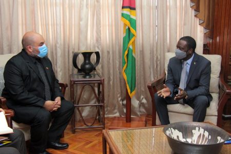 Hugh Todd (right) with Moses Chavez, Chargé d' Affaires, Embassy of the Bolivarian Republic of Venezuela