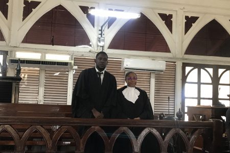 Jamaal Duff, who was admitted to the bar on Wednesday is seen here with Chief Justice (Ag) Roxane George-Wiltshire just after his petition was presented.