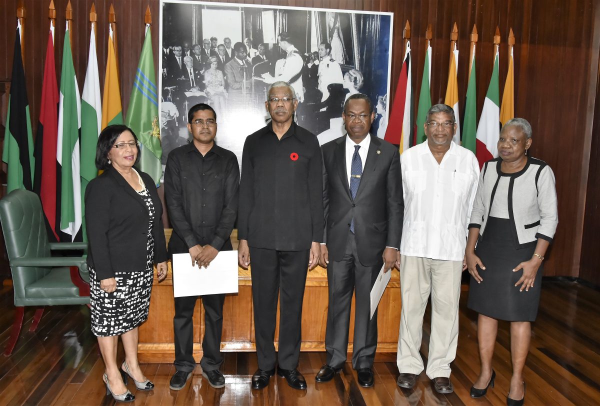 From left are Carol Corbin, Sukrishnalall Pasha, then President David Granger, Ivor English, Nanda Kishore Gopaul and Emily Dodson after the swearing in ceremony in 2016 (Ministry of the Presidency photo)