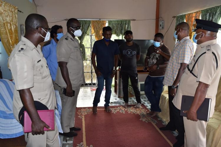 Commissioner of Police (ag), Nigel Hoppie, and several other senior officers of the Guyana Police Force meeting with the relatives of Dulmattie Boodlall who died after being struck by a GPF vehicle yesterday. (Photo courtesy of the GPF). 