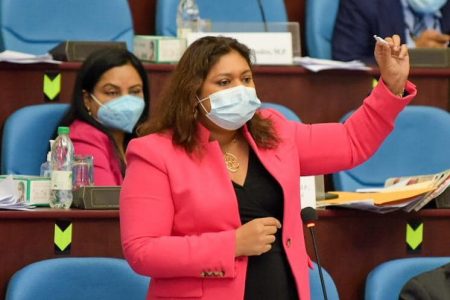 Minister of Education Priya Manickchand with what appears to be the replica of a  joint during her presentation on the Opposition  motion.
(DPI photo)