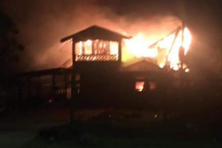 The house on fire yesterday morning (Renita Joseph photo)