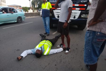 Injured Constable Roy Shanks lying on the roadway