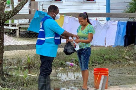 The CDC distributing cleaning supplies to flood-affected residents of Charity (DPI photo)