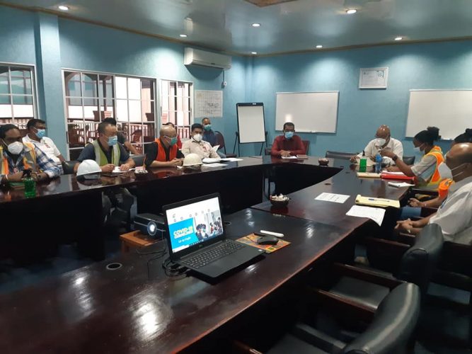 Minister of Public Works Juan Edghill engaging officials from China Harbour Engineering Company and the Cheddi Jagan International Airport on Friday (Works Ministry photo)
