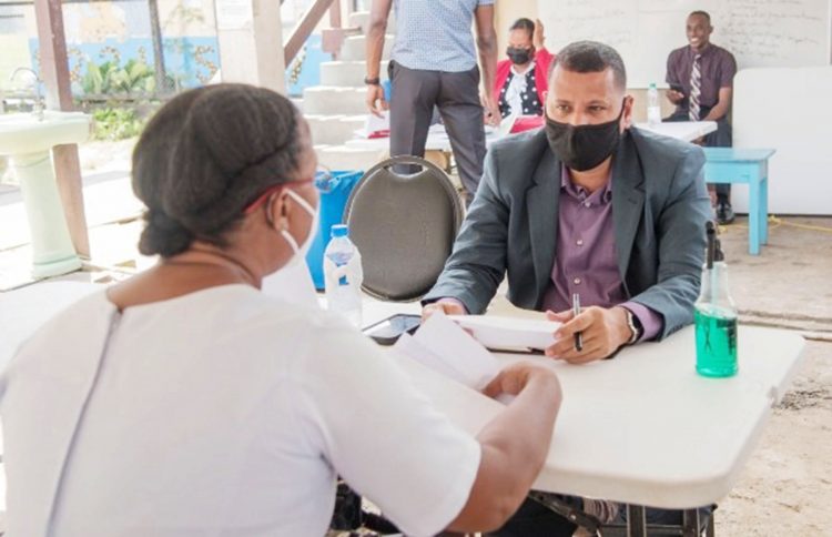 A resident sharing her concerns with Minister Collin Croal at the community outreach held at Little Diamond/Herstelling (DPI photo)                                                                                                                             