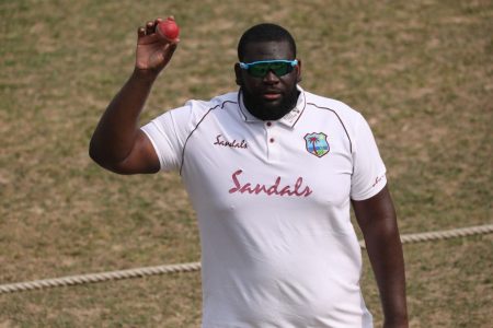 Off-spinner Rahkeem Cornwall leaves the field after celebrating his five-wicket haul yesterday. 