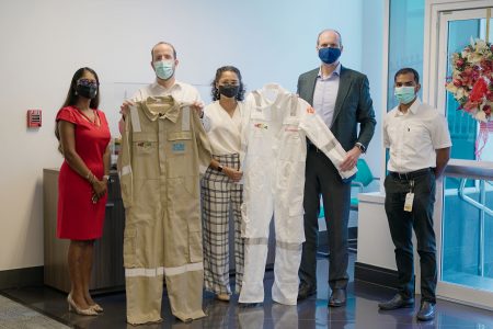 Representatives of the two companies handed over samples of the coveralls to ExxonMobil and SBM Offshore officials (ExxonMobil photo)