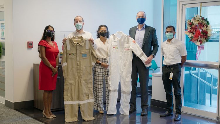 Representatives of the two companies handed over samples of the coveralls to ExxonMobil and SBM Offshore officials (ExxonMobil photo)