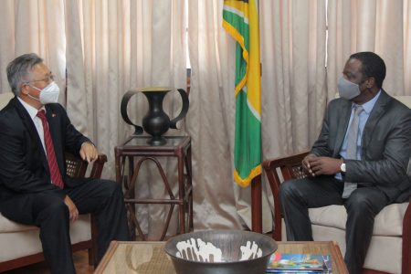 Chinese Ambassador to Guyana  Cui Jianchun (left) in discussion with Minister of Foreign Affairs, Hugh Todd yesterday. (Ministry of Foreign Affairs photo)
