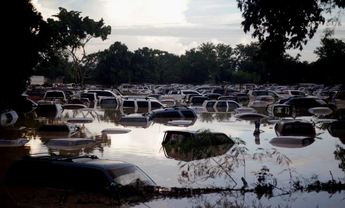 Vehicles are submerged at a plot flooded by the Chamelecon River due to heavy rain caused by Storm Iota, in La Lima, Honduras, on November 19, 2020. (REUTERS/Jorge Cabrera photo)  
