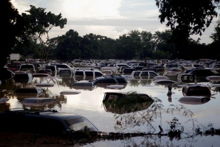 Vehicles are submerged at a plot flooded by the Chamelecon River due to heavy rain caused by Storm Iota, in La Lima, Honduras, on November 19, 2020. (REUTERS/Jorge Cabrera photo)
