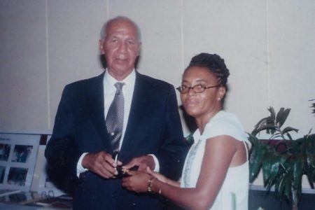 Philip Allsopp (left) being presented with a commemorative award on the occasion of his 50th anniversary as a practising engineer by Vice President of GAPE Heidi Gillette. (GAPE photo)