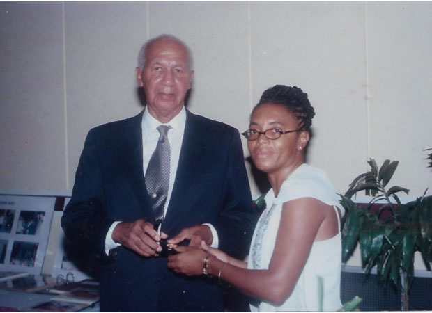 Philip Allsopp (left) being presented with a commemorative award on the occasion of his 50th anniversary as a practising engineer by Vice President of GAPE Heidi Gillette. (GAPE photo)