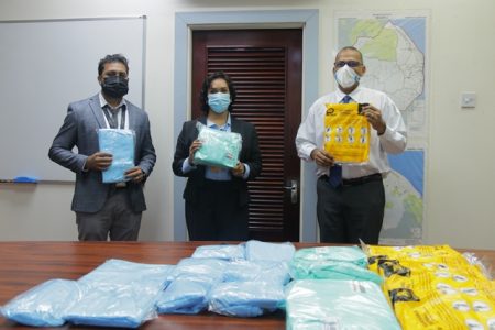 .L-R: GLASS Operations Manager,  Vincent Singh, Human Resources Manager,  Ramona Rahat and Minister of Health,  Dr Frank Anthony. (DPI photo)