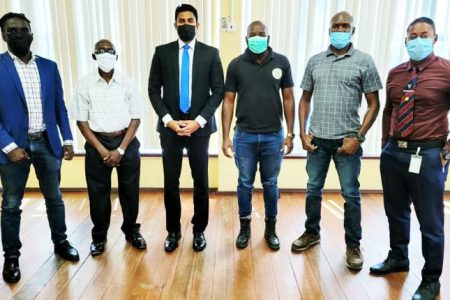 Sport Minister, Charles Ramson Jr. (third left) with members of the GRFU on Tuesday at the National Resource Centre.
