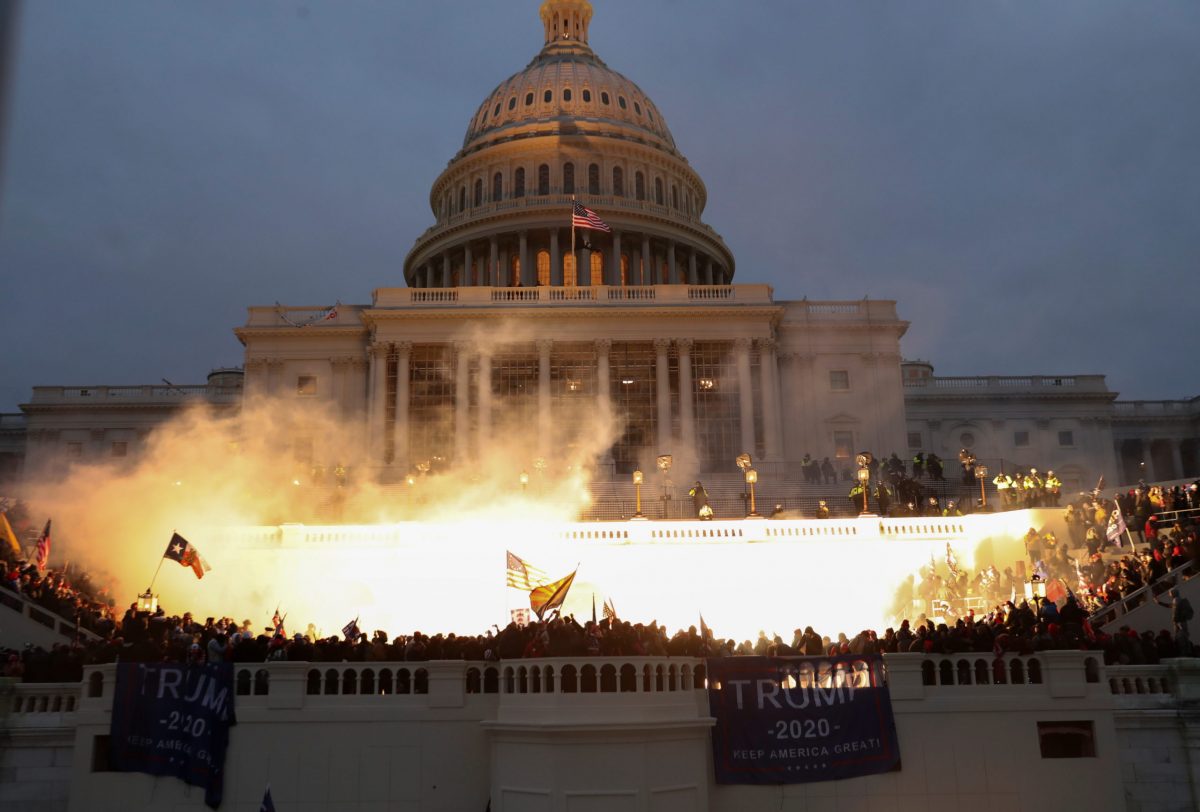 An explosion caused by a police munition is seen while supporters of U.S. President Donald Trump gather in front of the U.S. Capitol Building in Washington, U.S., January 6, 2021. REUTERS/Leah Millis