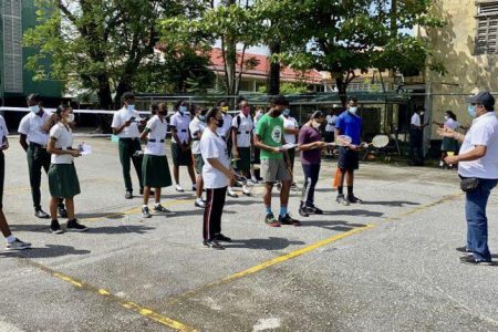 President of the Guyana Badminton Association, Gokarn  Ramdhani interacts with students of the St Rose High School.