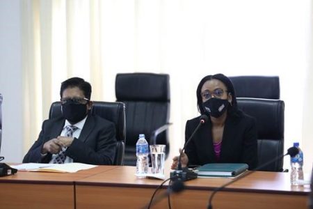 Minister in the Office of the President with responsibility for finance, Dr Ashni Singh (left) and Minister of Tourism, Industry and Commerce, Oneidge Walrond at the meeting.