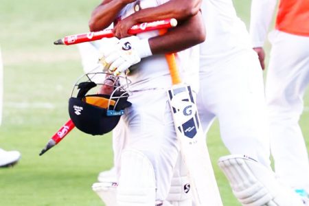 Mohammed Siraj hugs Rishabh Pant after the batsman’s unbeaten innings of 89 saw India to victory.
