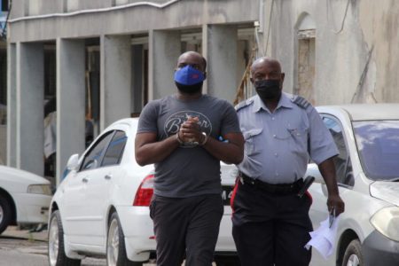 Colis Arlington Paul being escorted to court (Barbados Today photo)