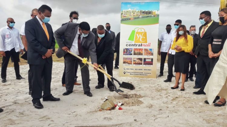 President Irfaan Ali (second from left) and project developer Hemraj Albert turning the sod
