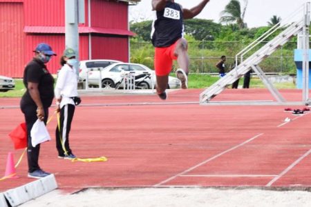 Emmanuel Archibald about to disturb the sand in a world leading (unofficial)8.07m on Sunday when the Athletic Association of Guyana (AAG) staged its first track and field meet for the year at the National Track and Field Centre.