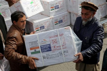 Workers from Afghan health ministry unload boxes containing vials of COVISHIELD, a coronavirus disease (COVID-19) vaccine donated by Indian government in Kabul, Afghanistan February 7, 2021. Credit: REUTERS