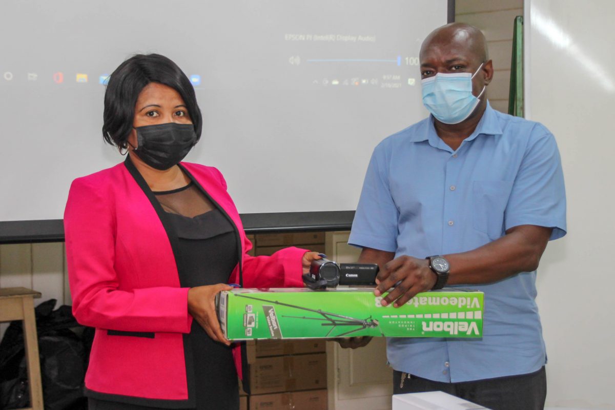 Advisor to the Minister of Education, Africo Selman (left) handing over some of the items to the Principal of the Guyana Industrial Training Centre, Dexter Cornette (Ministry of Education photo)