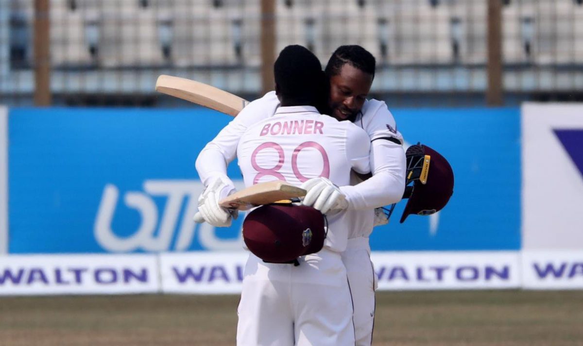 FLASHBACK! Nkrumah Bonner and Kyle Mayers, architects of the famous first test win against Bangladesh at Chattogram, embrace during their partnership. (Photo courtesy of Cricket West Indies)
