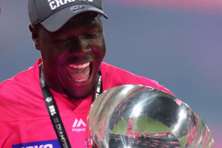 All-rounder Carlos Brathwaite celebrates with the Big Bash trophy. 