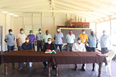 Seated are newly elected Demerara Cricket Board president, Bissondyal Singh (centre), Vice-Presidents, Roger Harper (right) and Bradley Fredericks (left) with the other executives of the board standing behind as well as Returning Officer and former GCB President, Norman McLean (standing right)