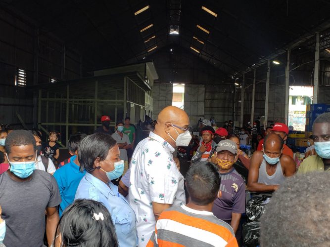 Minister Juan Edghill (centre) greeting passengers as they prepared to board the vessel yesterday afternoon
