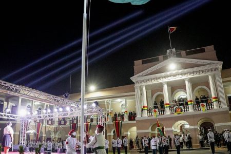 The Golden Arrowhead  being raised last evening at Public Buildings in observance of Guyana’s 51st anniversary of republican status. (Office of the President photo)