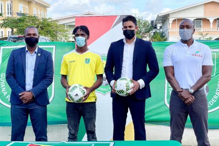 Golden Jaguars U20 captain Nicholas McArthur (2nd from left) posing with GFF President Wayne Forde (1st from left), Minister of Culture, Youth and Sport Charles Ramson Jr (3rd from left) and ABSAA founder Alex Bunbury