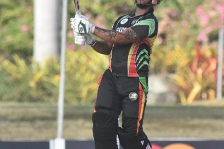 STAND AND ADMIRE: Left-hander Shimron Hetmyer admires one of his several boundaries during his hundred against Volcanoes on Thursday. (Photo courtesy CWI Media) 