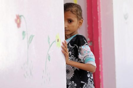 Ahmadiya Juaidi, 13, looks on as she stands at the door of her room at malnutrition treatment ward of al-Sabeen hospital in Sanaa, Yemen February 24, 2021. REUTERS/Khaled Abdullah
