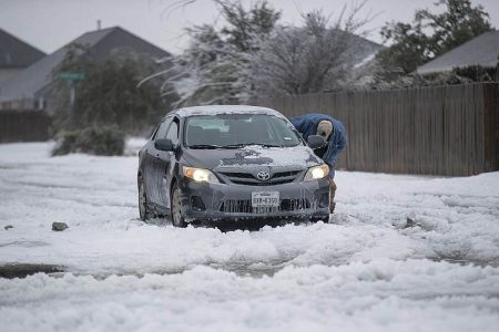 A vehicle stuck on a snow-covered road in Austin on Wednesday. (AP pic)
