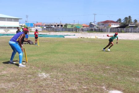 Coach Ryan Hercules going through some fielding drills with West Indies all-rounder, Cherry-Ann Fraser (right) and some members of the Demerara female training squad. (Romario Samaroo photo)
