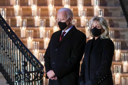 U.S. President Joe Biden and his wife, Jill Biden, pause for a moment of silence at the White House on Monday to mark the grim milestone of 500,000 U.S. deaths from COVID-19. | REUTERS