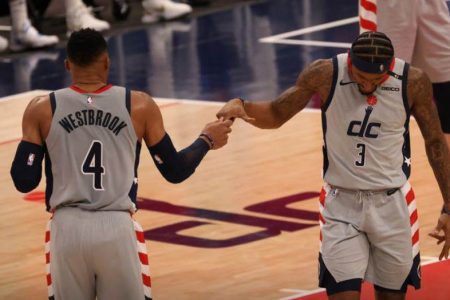  Russell Westbrook and Bradley  Beal celebrate their team’s come-from-behind win Sunday night. (Reuters photo)