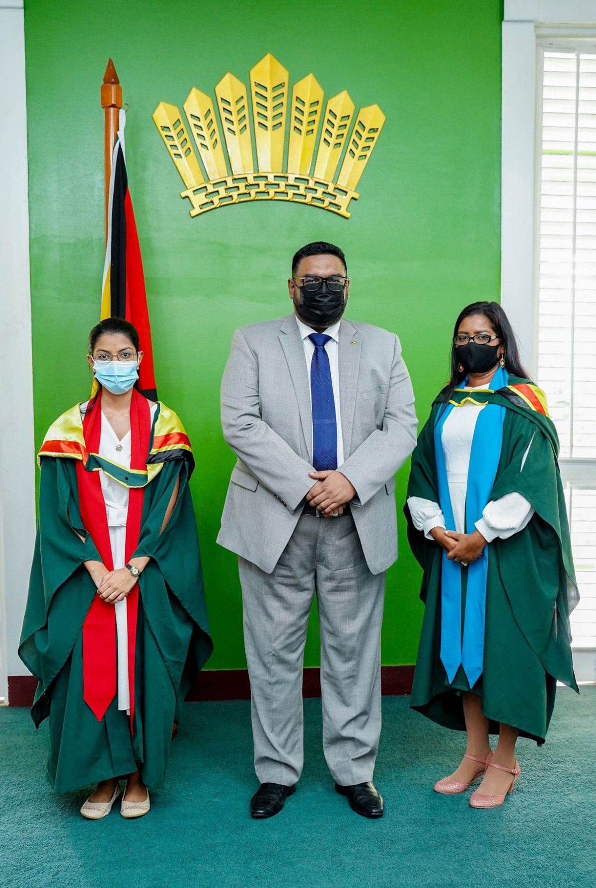UG Valedictorians: President Irfaan Ali on Friday with the recipients of the 2020 President’s Medal, Deepa Odit (at left) and Savitree Budram. The University of Guyana last evening held the first of five convocation ceremonies for its 2019/2020 graduation class.  Odit, 24, who has completed a Bachelor of Science Degree in Pharmacy, is the Valedictorian of the Turkeyen Campus, while Budram, 36, who completed a Bachelor of Education (Administration) Degree, is the Valedictorian of the university’s Tain Campus. (Office of the President photo)