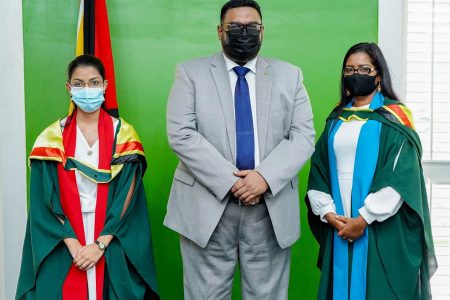 UG Valedictorians: President Irfaan Ali on Friday with the recipients of the 2020 President’s Medal, Deepa Odit (at left) and Savitree Budram. The University of Guyana last evening held the first of five convocation ceremonies for its 2019/2020 graduation class.  Odit, 24, who has completed a Bachelor of Science Degree in Pharmacy, is the Valedictorian of the Turkeyen Campus, while Budram, 36, who completed a Bachelor of Education (Administration) Degree, is the Valedictorian of the university’s Tain Campus. (Office of the President photo)